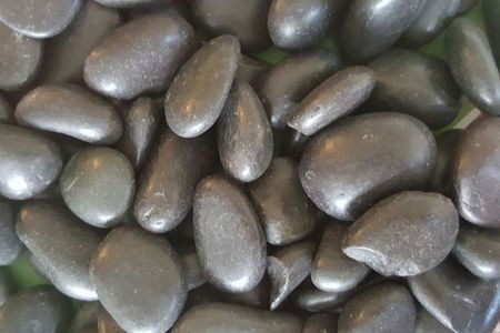 Waxed black beach pebble