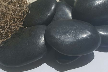 Waxed black beach pebble