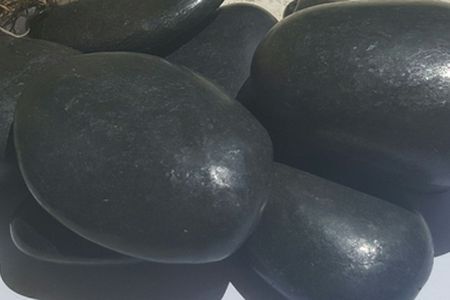 Waxed black beach pebble