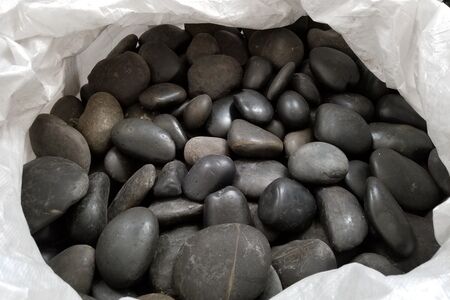 5-10in Waxed black beach pebble